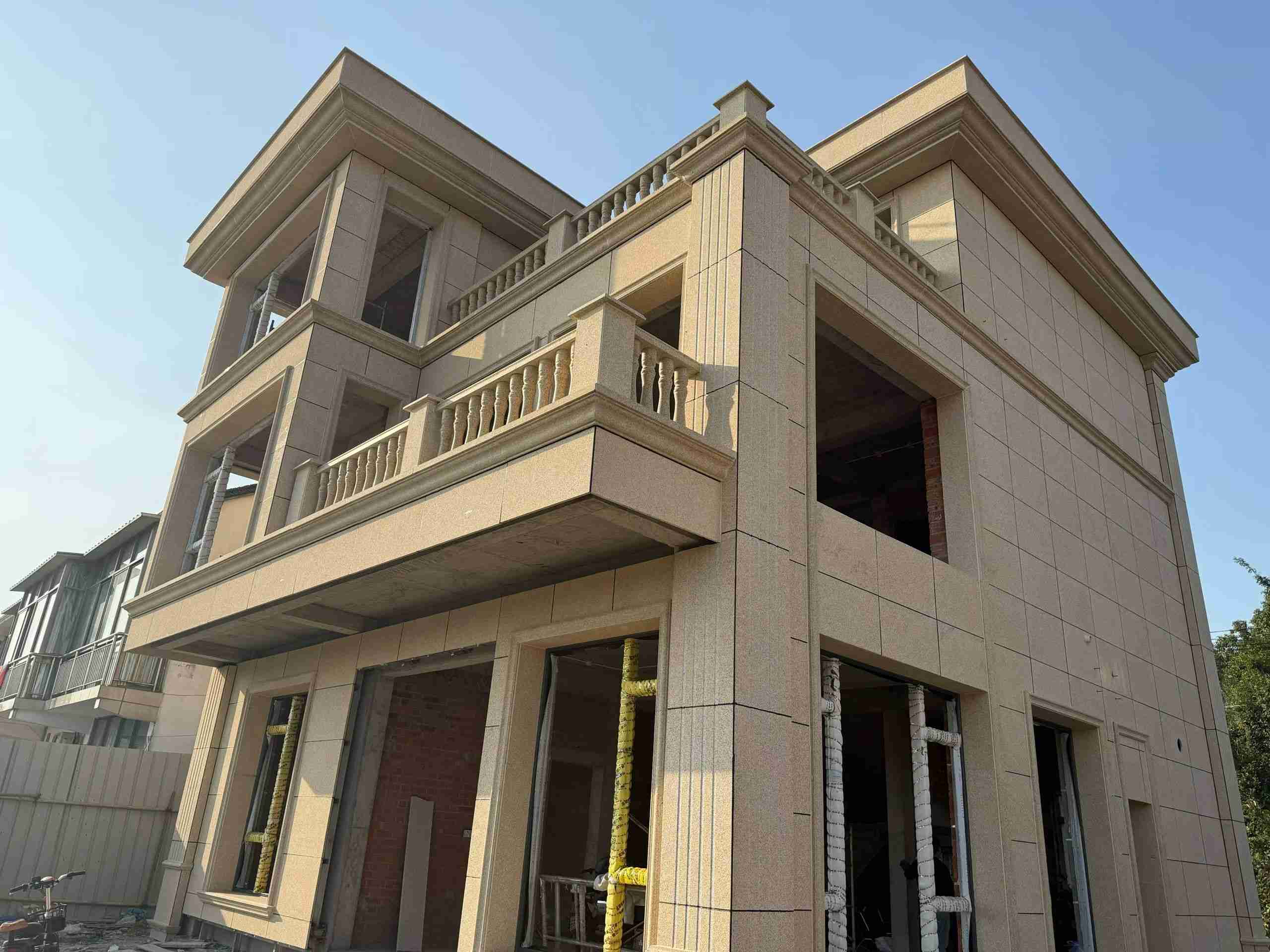 九江 黄金麻花岗岩石材荔枝面外墙干挂效果展示